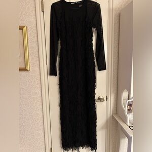 Gorgeous fringe black formal dress. Dress is tank. Long sleeve black shirt incl